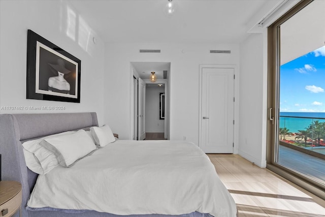 bedroom with light wood-type flooring