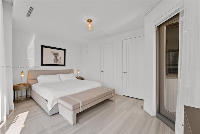 bedroom with light wood-type flooring