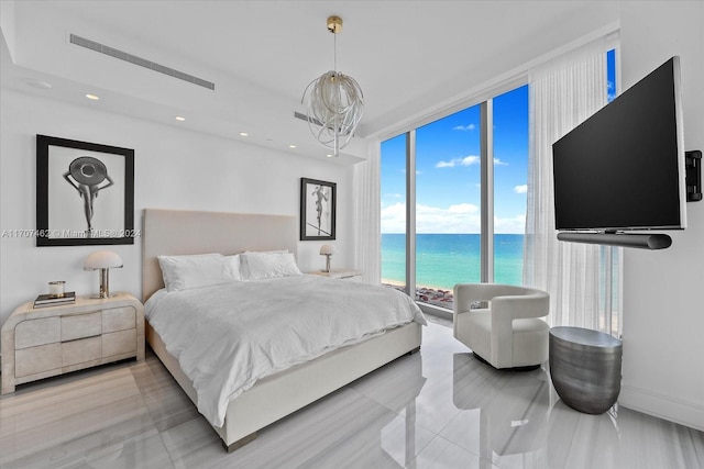 bedroom with floor to ceiling windows