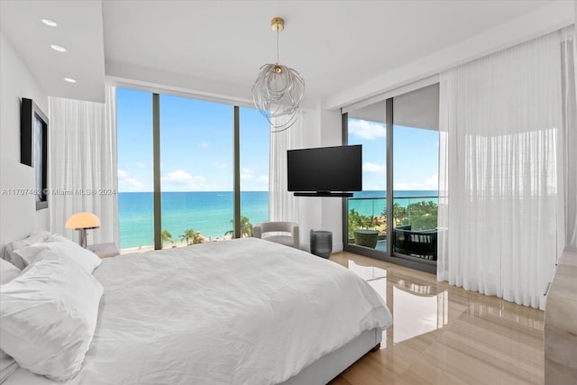 bedroom featuring light hardwood / wood-style floors and access to outside