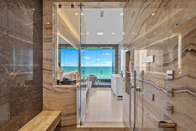 bathroom featuring a water view