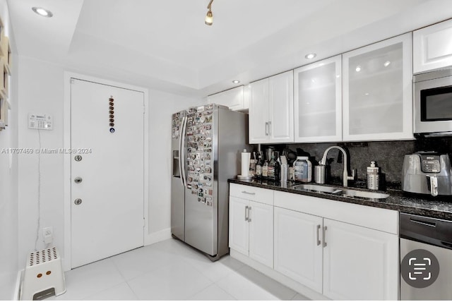 kitchen with sink, white cabinets, and stainless steel appliances