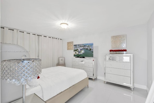 bedroom with tile patterned floors