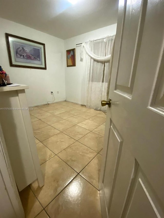 washroom with light tile patterned floors