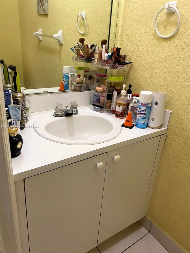 bathroom featuring tile patterned floors and vanity