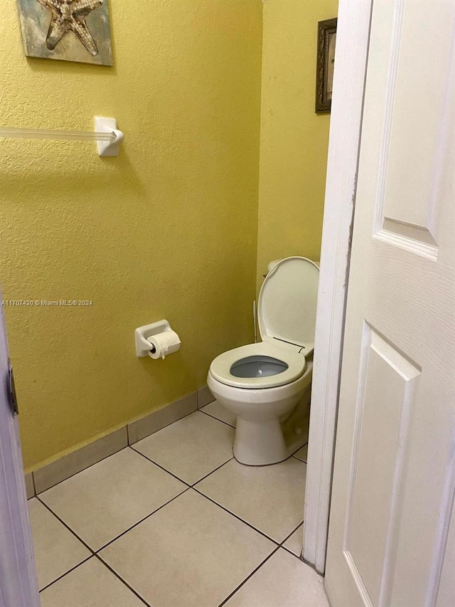 bathroom with tile patterned flooring and toilet