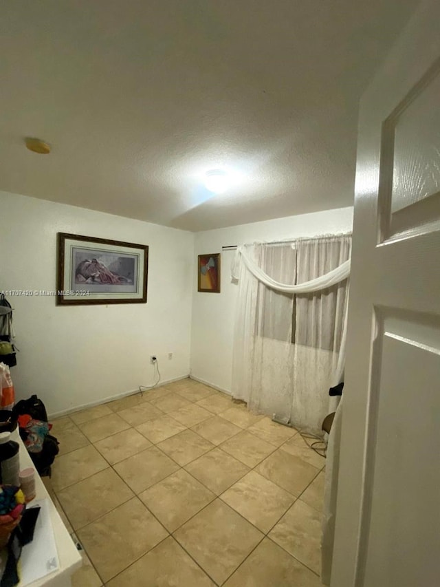 interior space featuring light tile patterned flooring