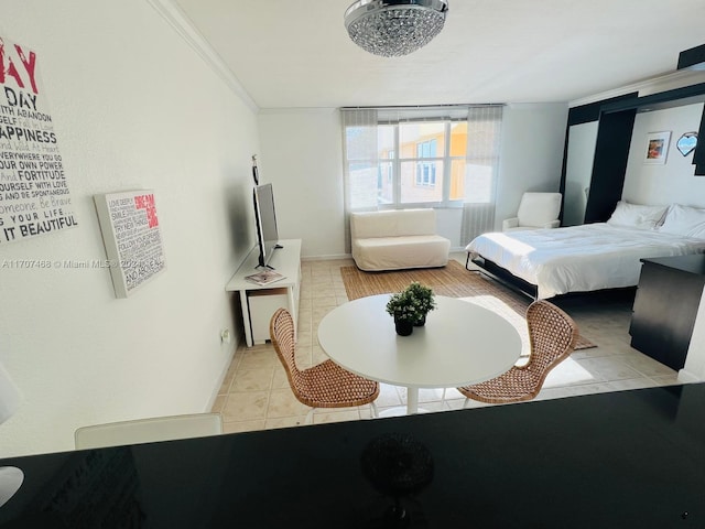 bedroom featuring light tile patterned flooring and crown molding