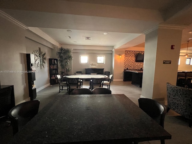 dining room featuring carpet and ornamental molding