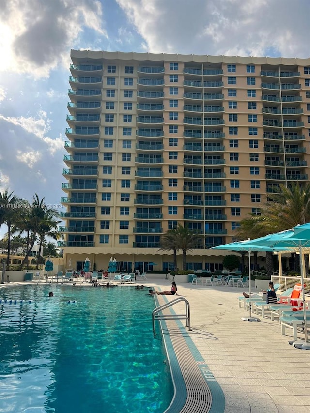 view of swimming pool with a patio