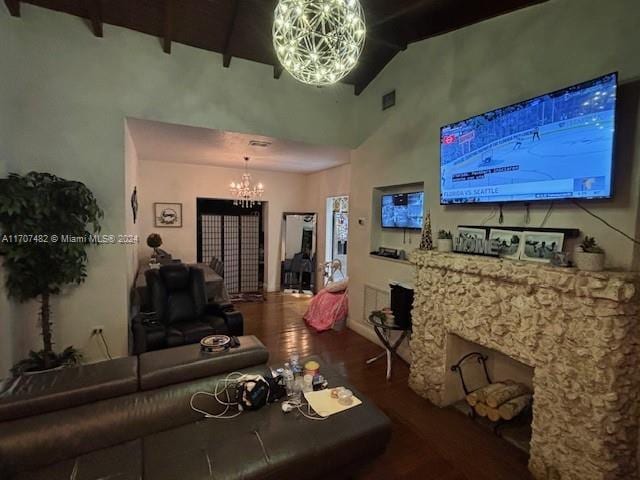 living room featuring beamed ceiling, wood-type flooring, high vaulted ceiling, and a chandelier