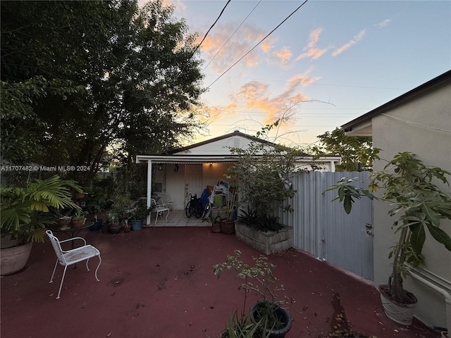 view of patio terrace at dusk