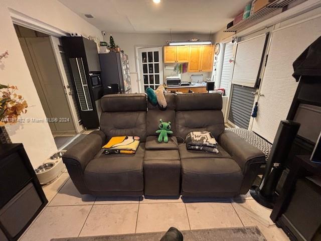 living room featuring light tile patterned flooring