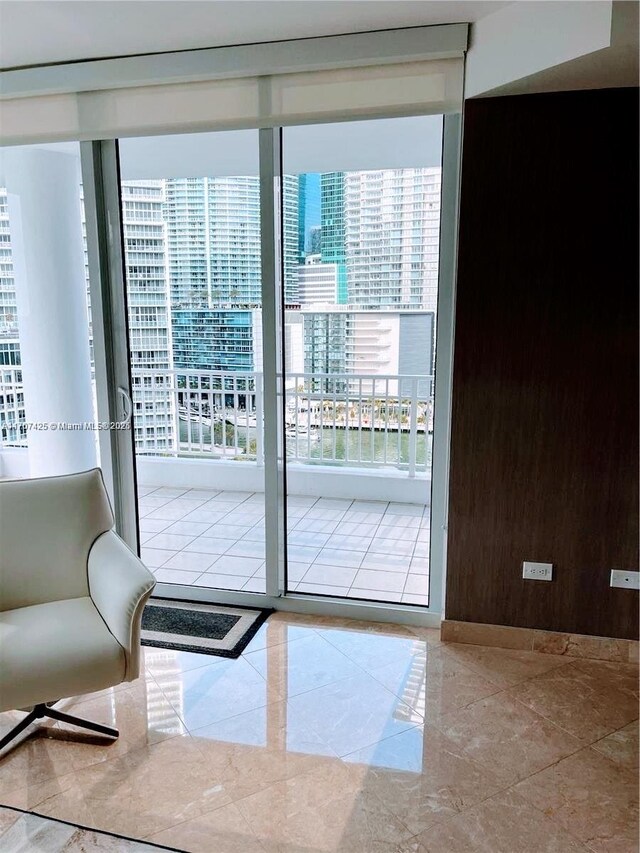 living room with expansive windows and a healthy amount of sunlight