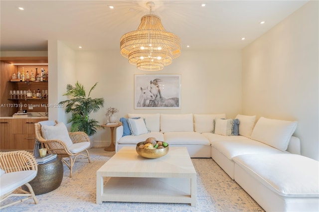 living area featuring recessed lighting, baseboards, and an inviting chandelier