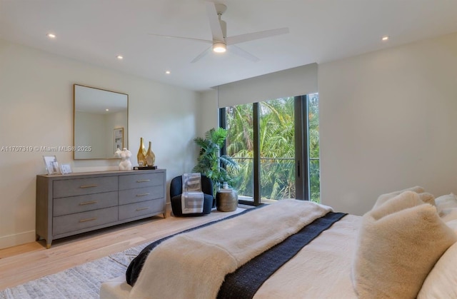 bedroom with light wood-style floors, ceiling fan, baseboards, and recessed lighting