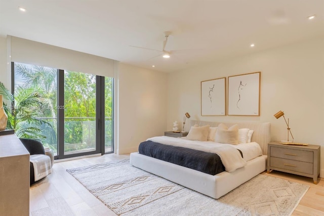 bedroom with access to exterior, light wood finished floors, a ceiling fan, and recessed lighting