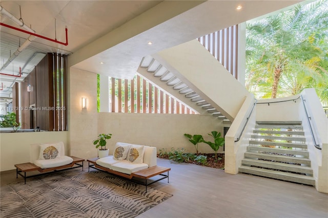 view of patio with outdoor lounge area and stairway