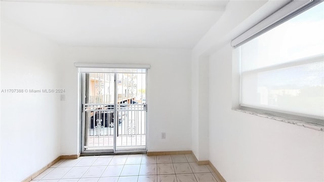 spare room with light tile patterned floors