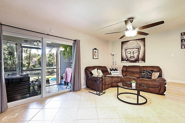 tiled living room with ceiling fan and a wealth of natural light