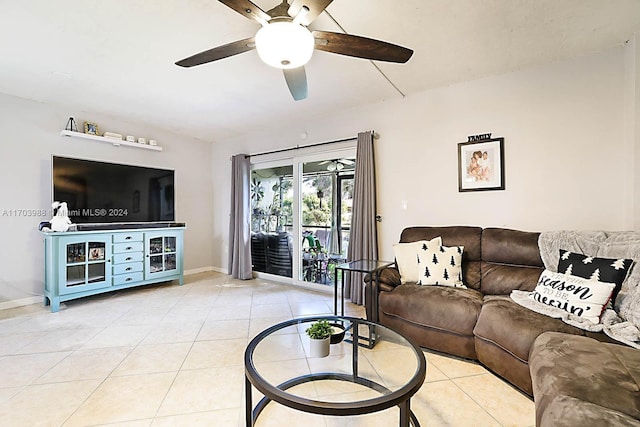 tiled living room featuring ceiling fan