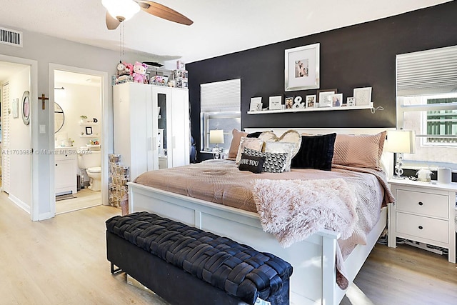 bedroom featuring ensuite bathroom, ceiling fan, and light hardwood / wood-style floors