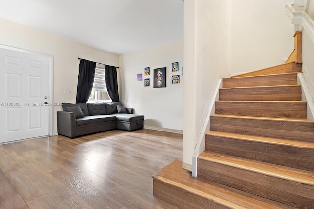 stairway with wood finished floors