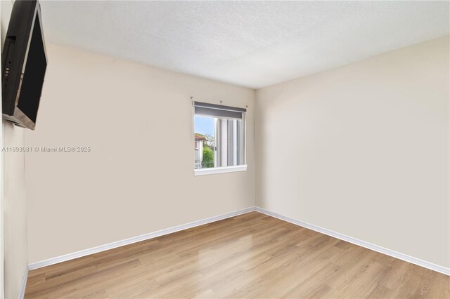 unfurnished living room with light hardwood / wood-style flooring