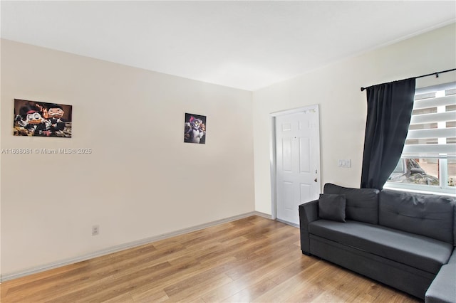 living room featuring light wood-style floors and baseboards