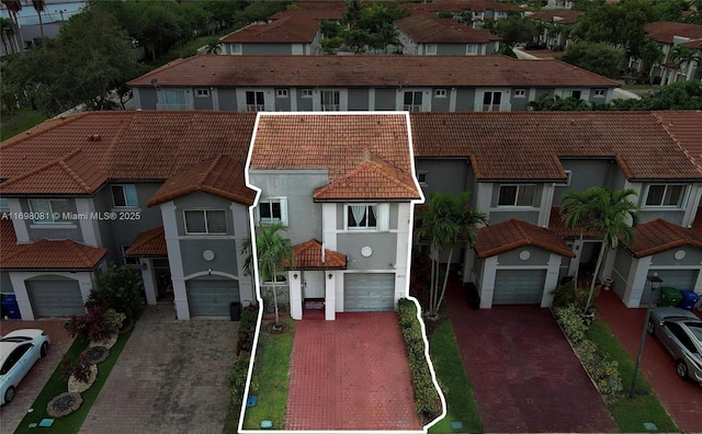 2872 SW 127th Way Unit 1, Miramar, FL 33027 - view of front of home with a tile roof, driveway, a residential view, and stucco siding