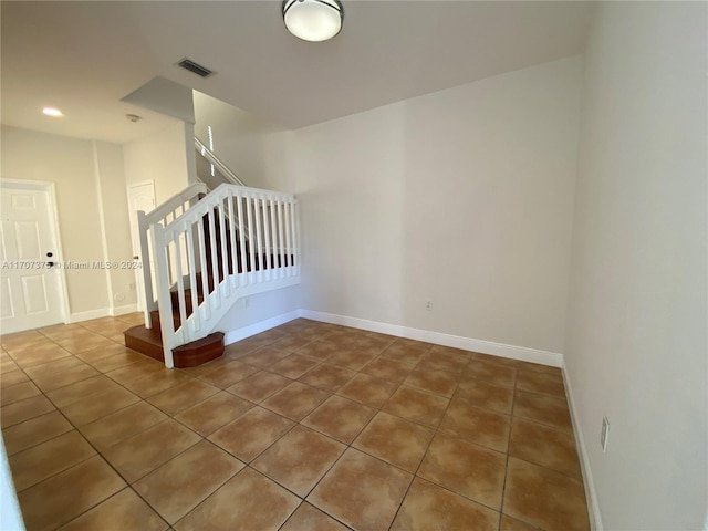 staircase with tile patterned flooring