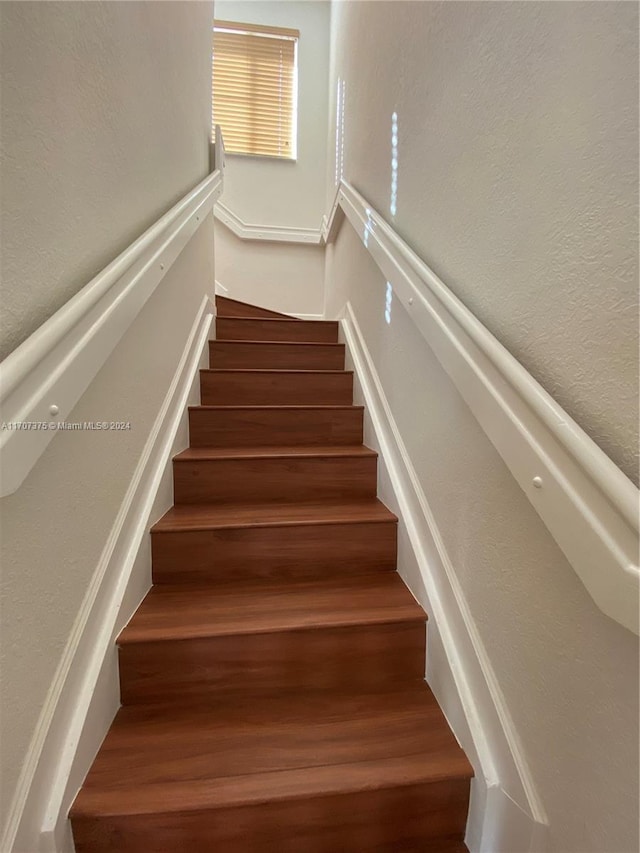 stairs with wood-type flooring