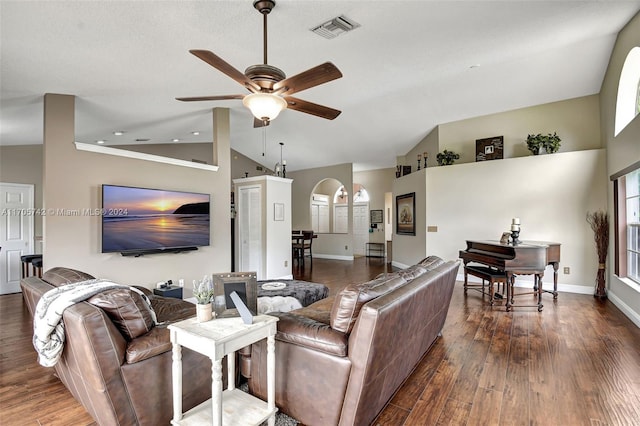 living room featuring ceiling fan, high vaulted ceiling, and dark hardwood / wood-style floors