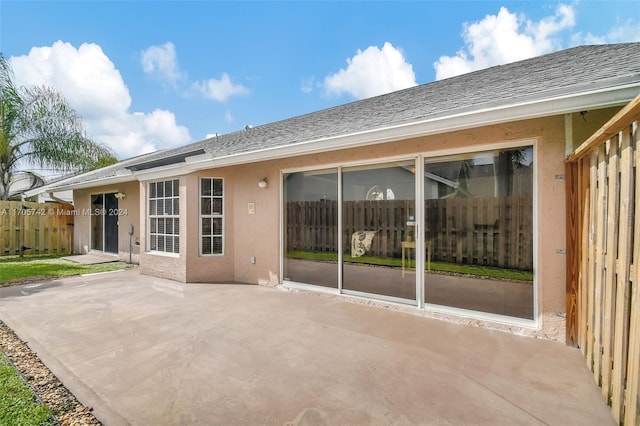 rear view of house with a patio