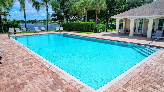 view of swimming pool with a patio area