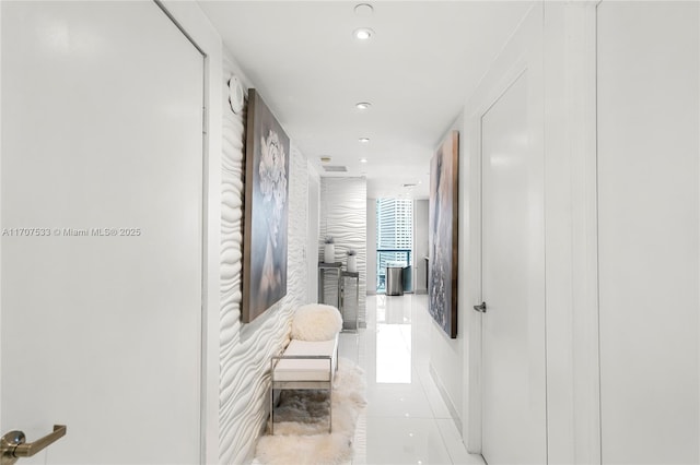 hall featuring light tile patterned floors