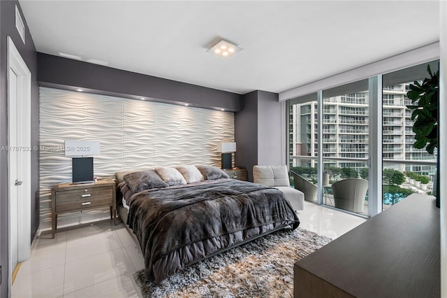 tiled bedroom with expansive windows