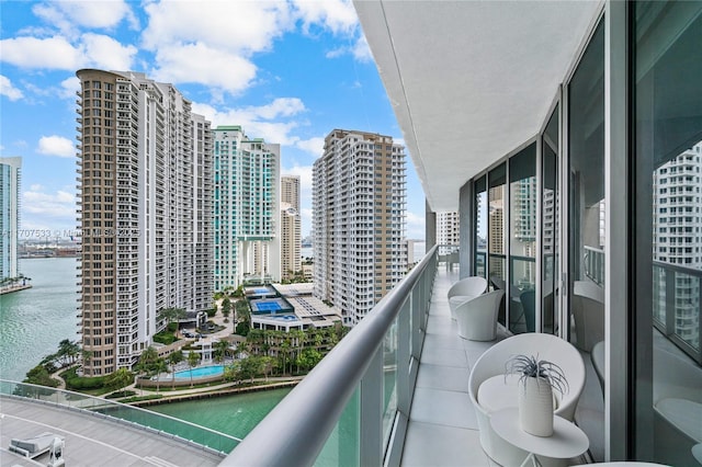 balcony featuring a water view