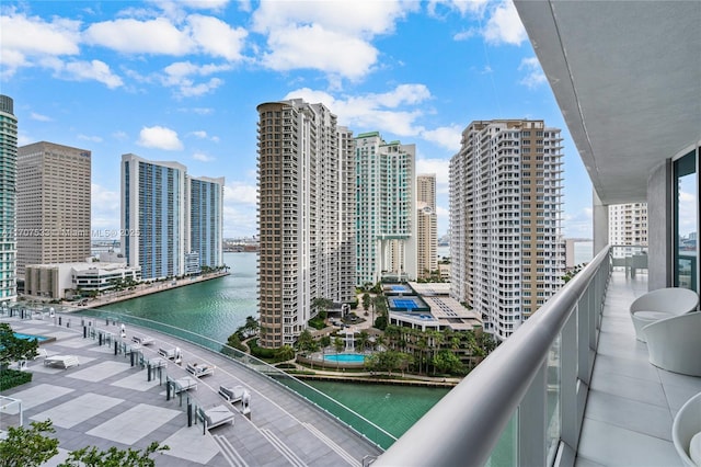 balcony featuring a water view