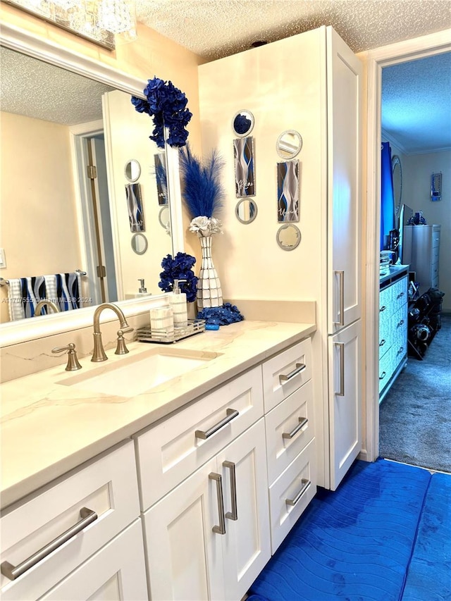 bathroom featuring vanity and a textured ceiling