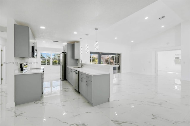 kitchen featuring gray cabinetry, plenty of natural light, and appliances with stainless steel finishes