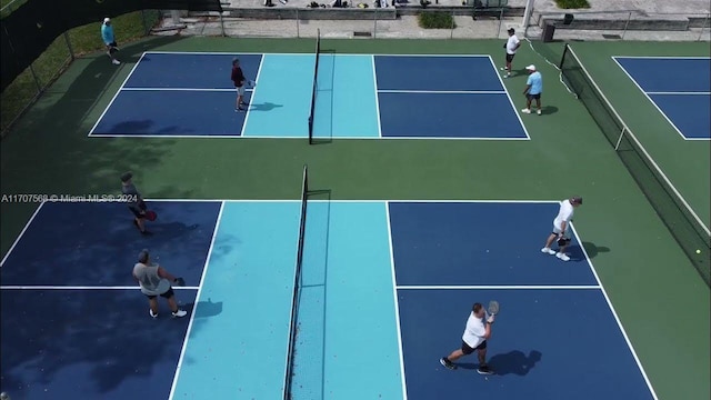 view of tennis court featuring basketball court