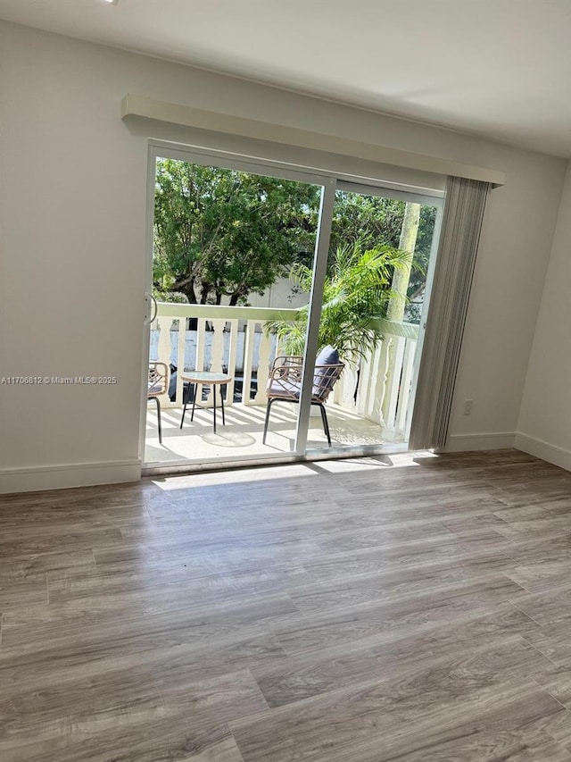 spare room with light wood-type flooring