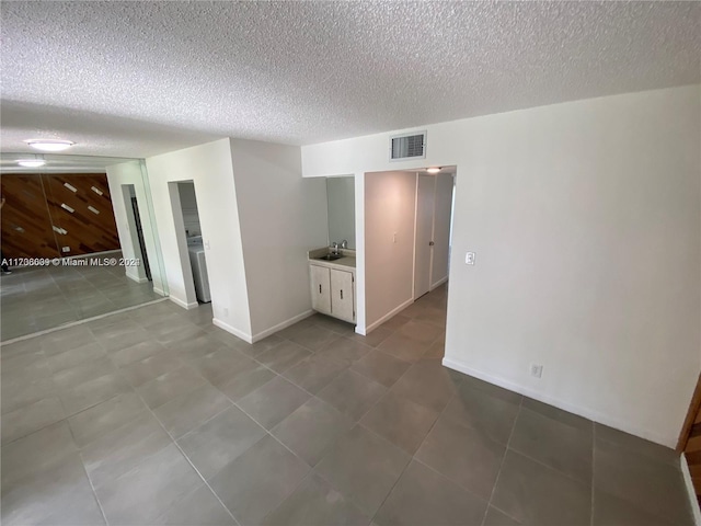 empty room with a textured ceiling