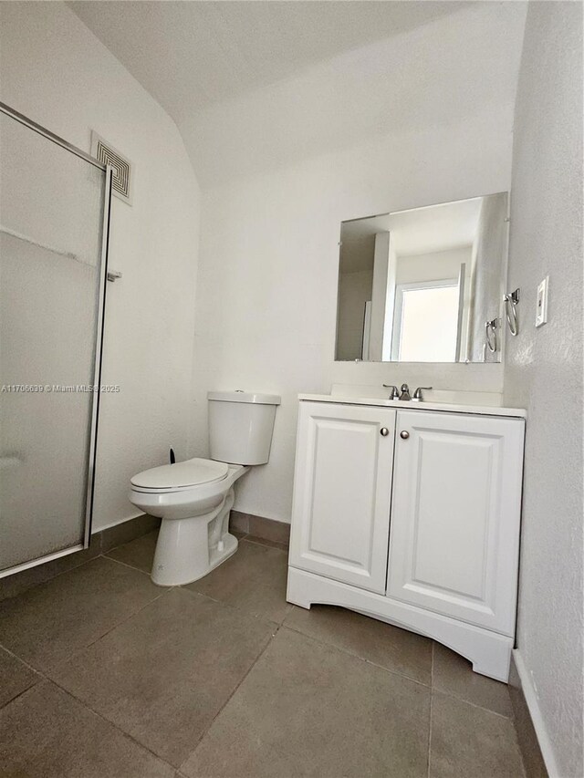 spare room with a textured ceiling and hardwood / wood-style flooring