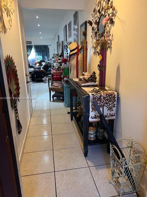 hallway with light tile patterned floors