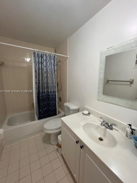 full bathroom featuring shower / bathtub combination with curtain, vanity, tile patterned floors, and toilet