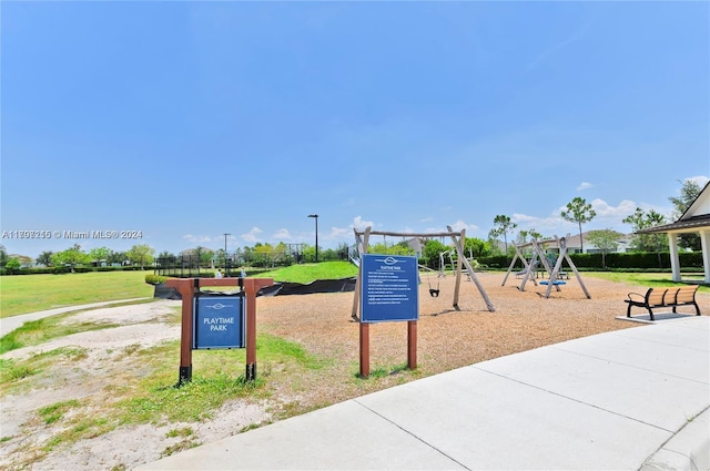 view of play area featuring a lawn