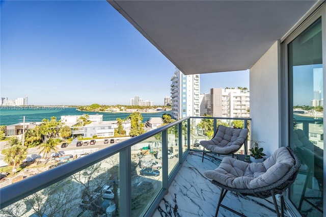 balcony featuring a water view