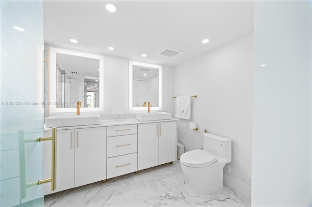 bathroom with vanity, toilet, and an enclosed shower